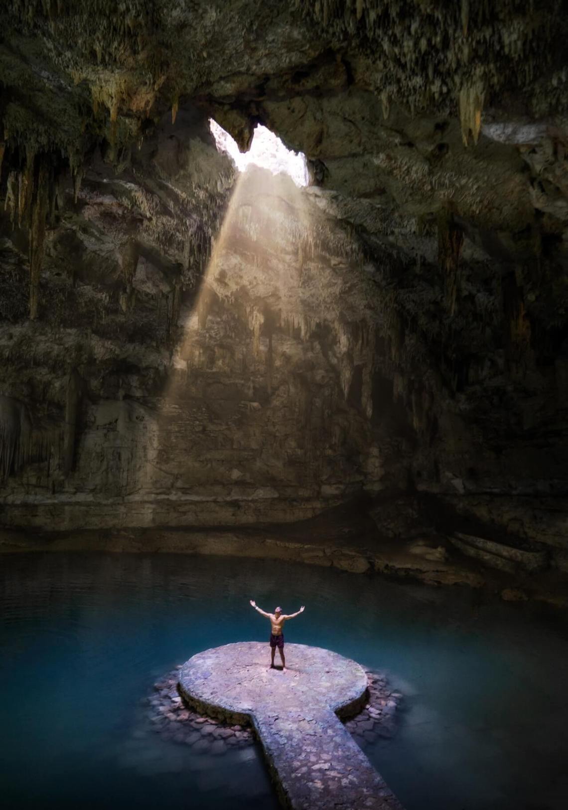 Man standing in the Cenote Suytun