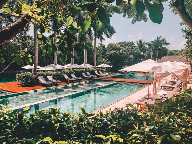 Sun loungers near a swimming pool on the Riviera Maya